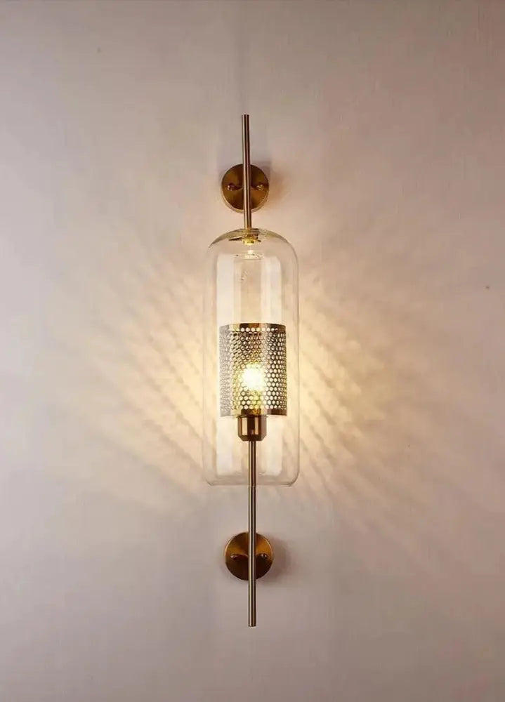 DecorBites™ moroccan modern bathroom wall sconce with brass finish, clear glass cylinder, and perforated metal shade