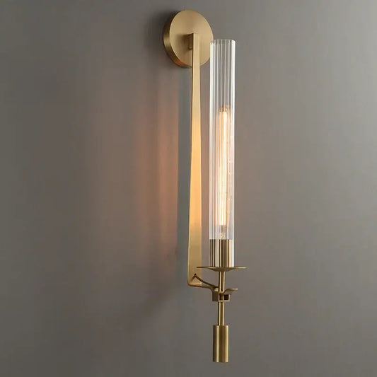 DecorBites™ Moroccan wall sconce with brass finish and clear glass cylinder featuring exposed filament bulb, modern gold wall sconce
