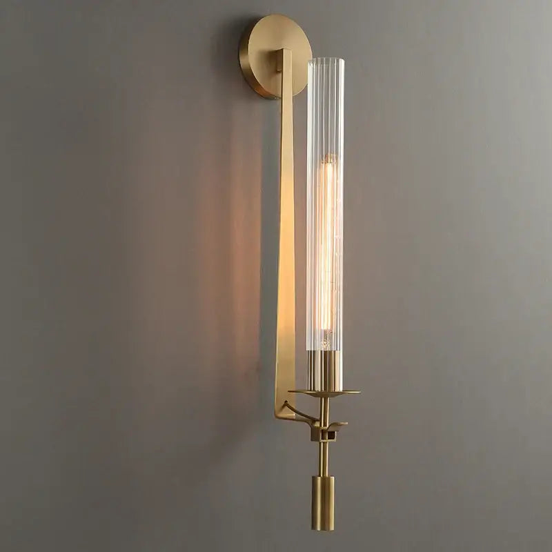 DecorBites™ Moroccan wall sconce with brass finish and clear glass cylinder featuring exposed filament bulb, modern gold wall sconce