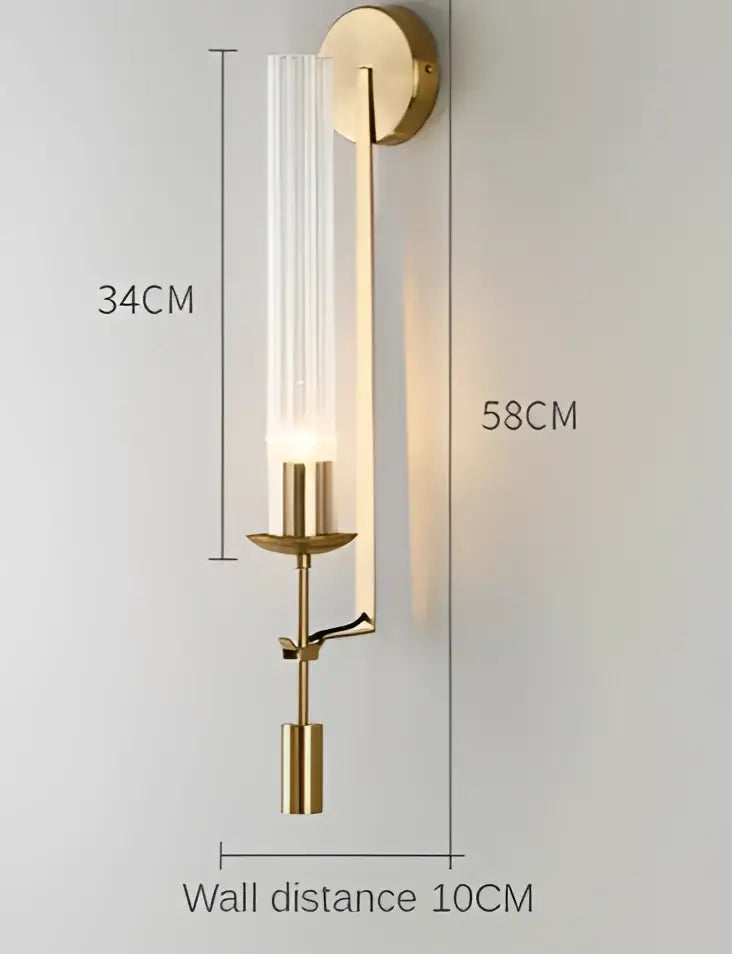 Decorbites™ moroccan wall sconce with a modern gold wall design featuring a clear glass cylinder and brass accents