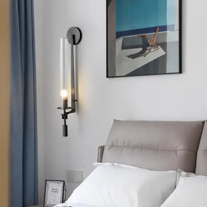 DecorBites™ modern black metal wall sconce with clear glass cylinder and warm light ideal for wall sconces decor