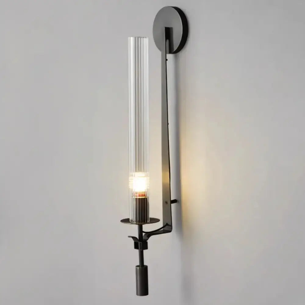 Decorbites™ moroccan wall sconce with modern black metal frame and clear vertically ribbed glass cylinder bulb cover