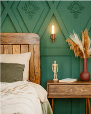 Rustic wooden nightstand with terracotta vase beside moroccan rechargeable battery operated wall sconce
