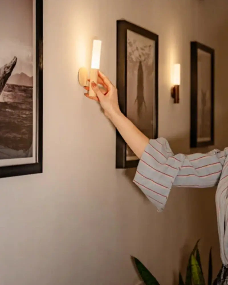 Decorbites moroccan rechargeable battery operated wall sconce with warm white cylinder light and natural wood base