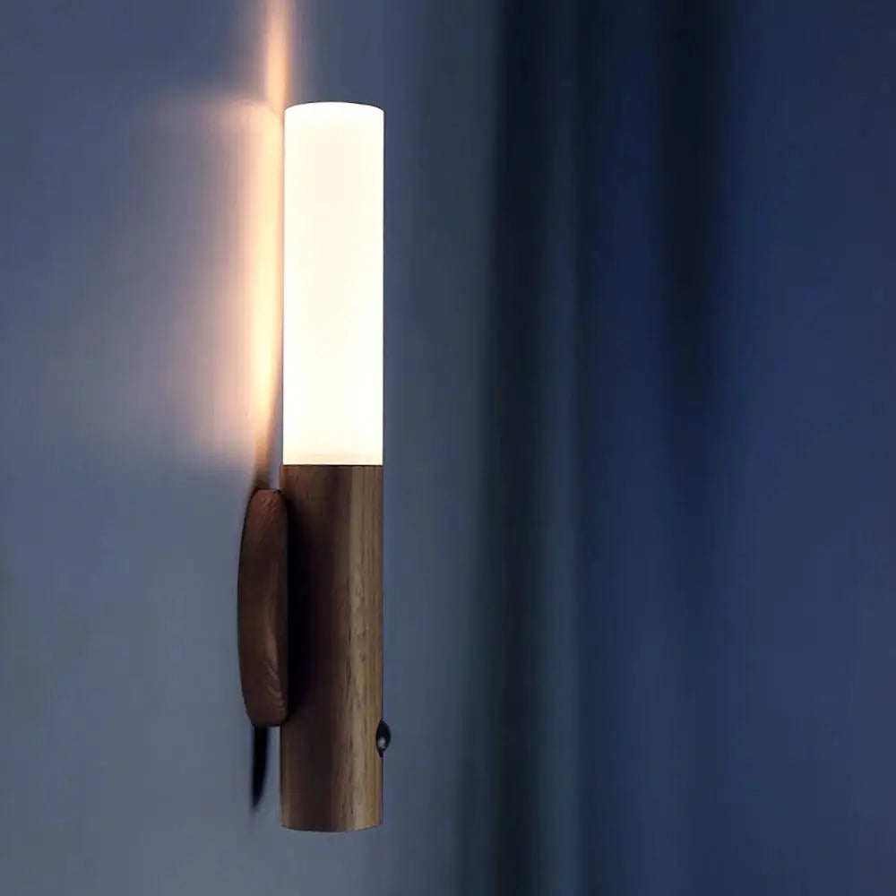 Warm-toned moroccan rechargeable battery operated wall sconce with frosted glass diffuser and natural wood base