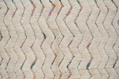 Cream-colored plush shag rug with zigzag pattern in rust and gray handcrafted as decorbites™ handmade traditional azilal rug