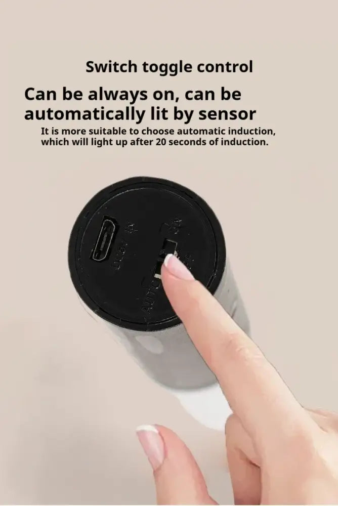 Black DecorBites™ motion sensor battery operated wall lamp with switch and charging port for convenient use