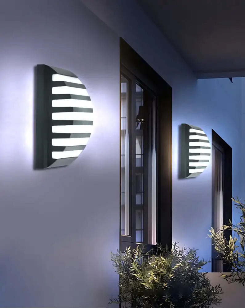 Modern black semi-circular outdoor wall light with horizontal white led strips and motion sensor by decorbites