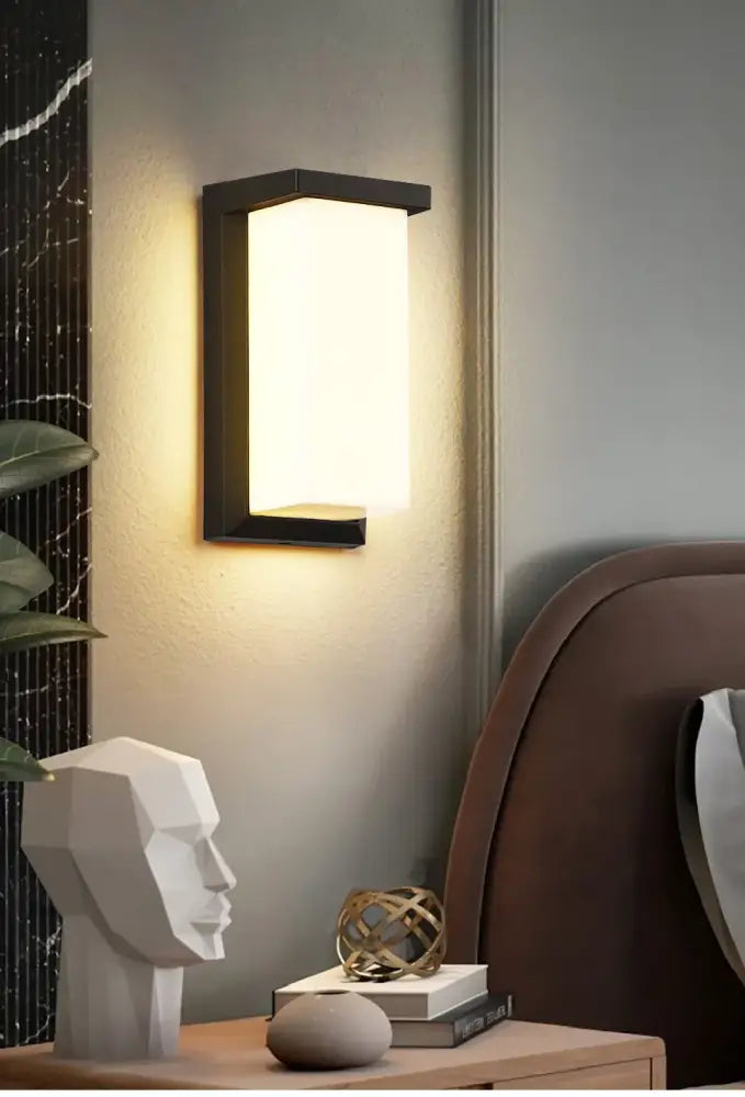 Modern black-framed rectangular decorbites™ motion sensor outdoor wall light with warm diffused light and waterproof design