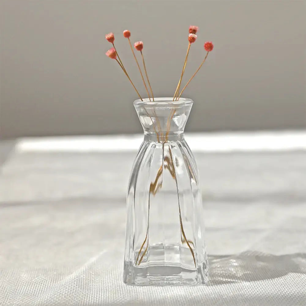 Clear glass vase with a faceted geometric design narrow neck opening 2cm decorative flower pot by DecorBites