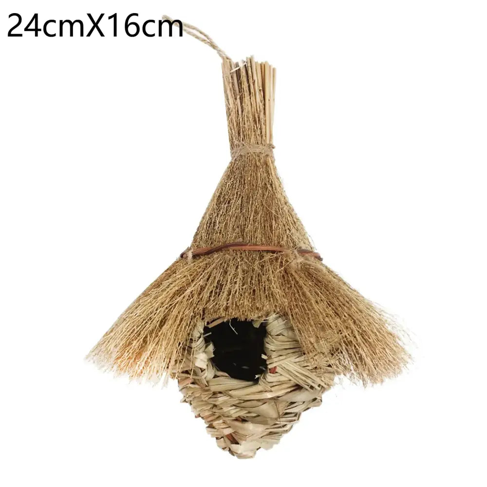 A rustic handcrafted natural grass bird cage with a woven base and conical roof for outdoor decor by decorbites