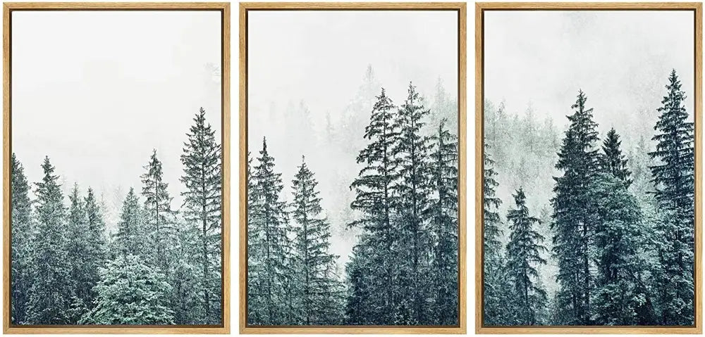 Set of three DecorBites™ nature landscape canvas prints with misty pine trees in muted teal and gray tones in light wood frames