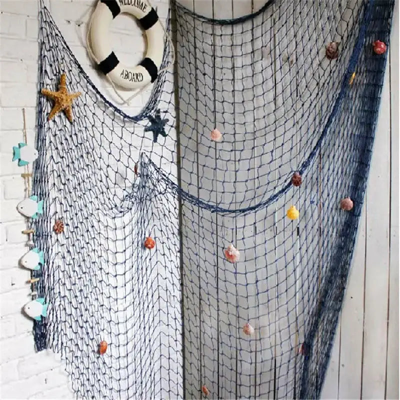 Decorbites™ nautical theme wall decor featuring blue fishing net decoration with colorful seashells and starfish accents