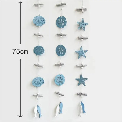 Decorbites™ nautical theme wall decor with blue wooden strands featuring shells, starfish, sand dollars, and fishing net decoration