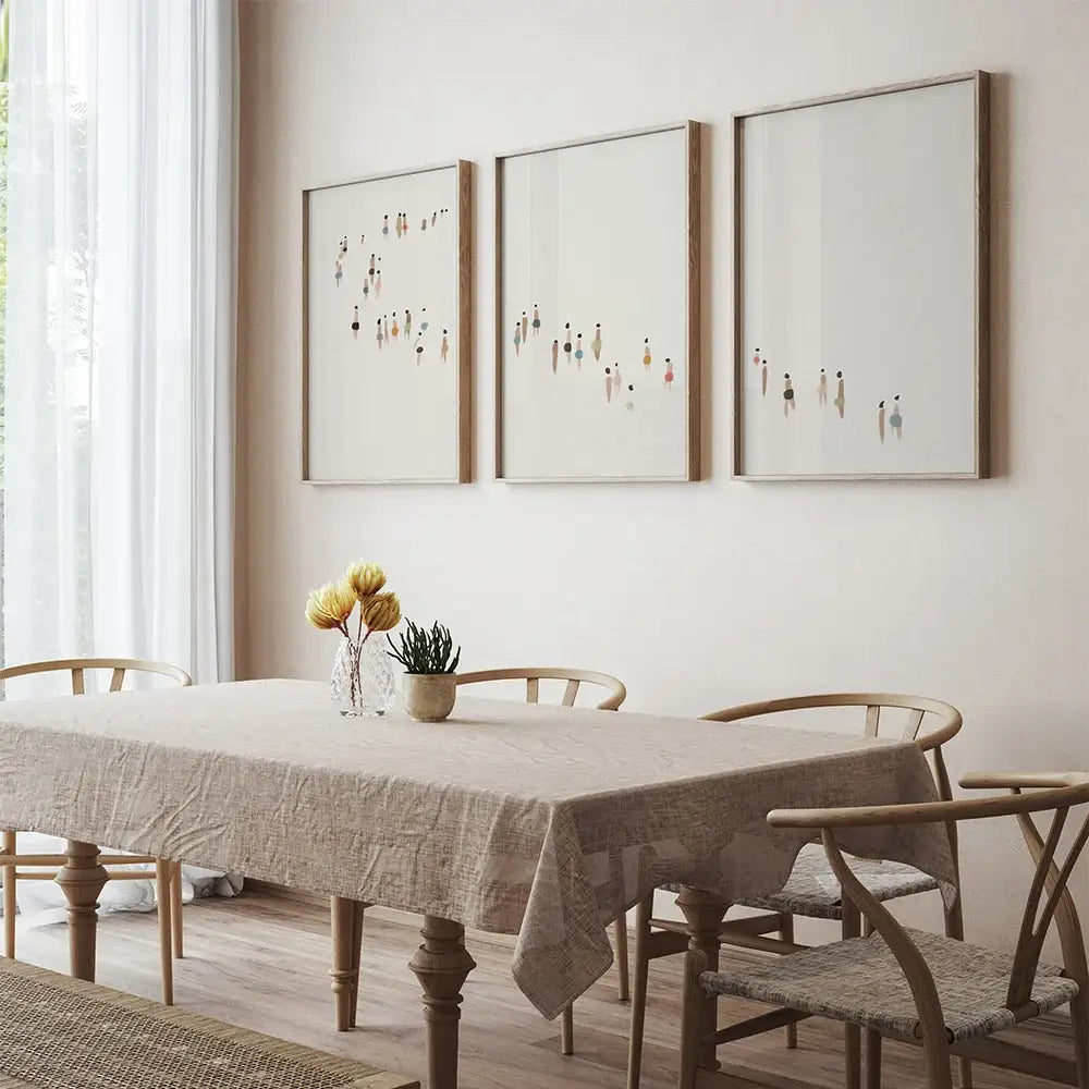Beige linen tablecloth with subtle textured weave on wooden dining table complementing decorbites™ wall art set