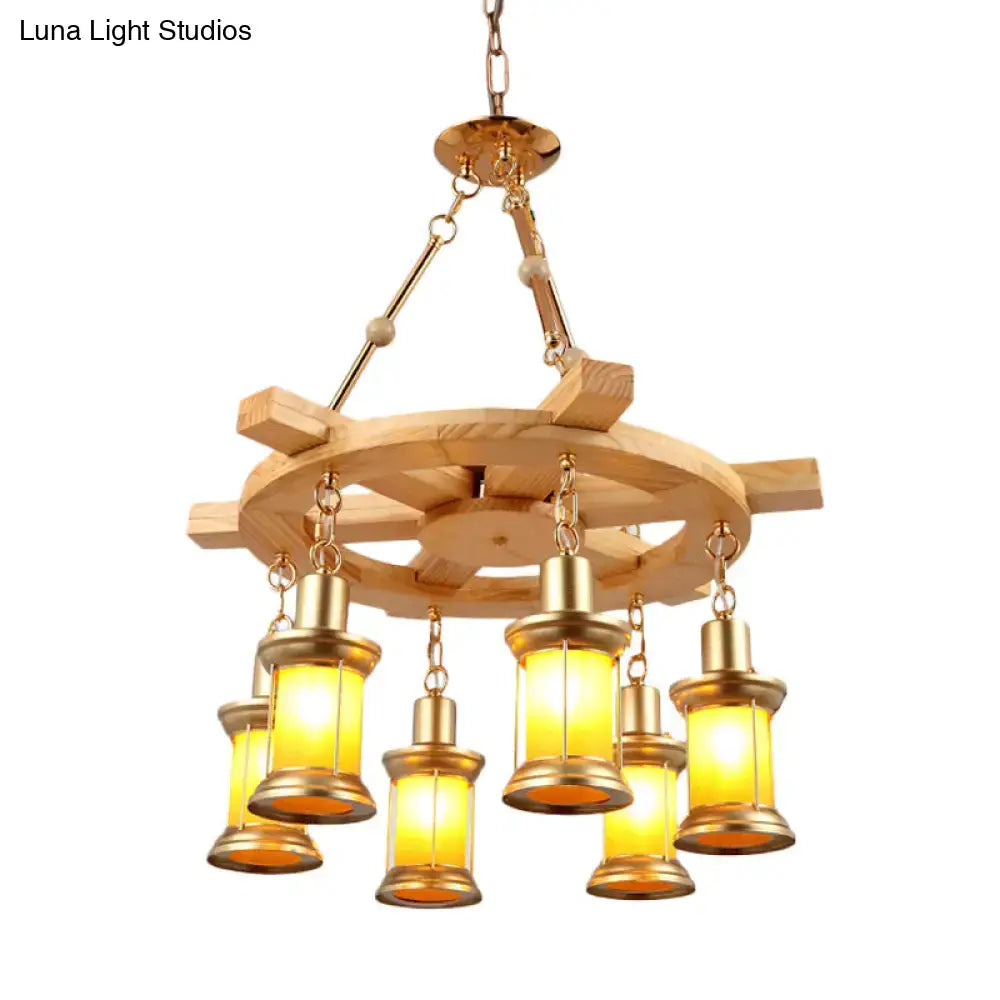 DecorBites Noemi industrial pendant chandelier with rustic wood rudder, brass accents, and amber glass lanterns