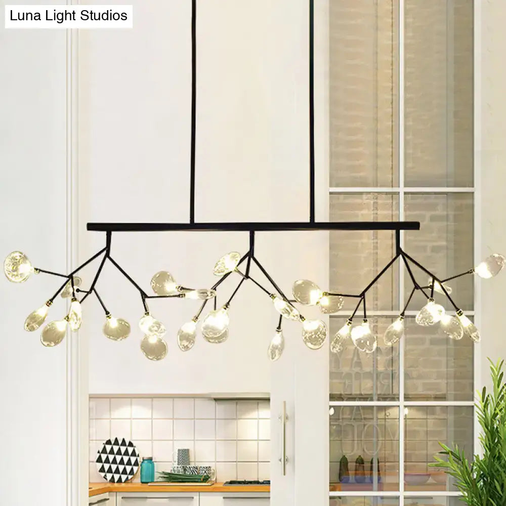 Black metal DecorBites Nordic ceiling light with tree branch glass arms holding clear teardrop bulbs for dining room island