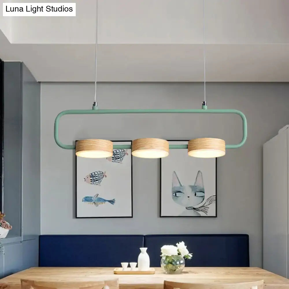 DecorBites™ nordic 3-light hanging pendant with mint green metal frame and wooden lampshades adds modern touch to kitchen island