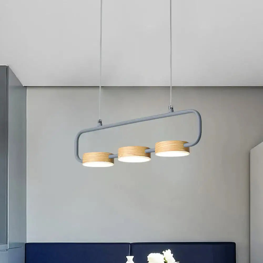 Decorbites™ nordic 3-light hanging pendant with gray metal frame and wooden lampshades adding modern touch to kitchen island