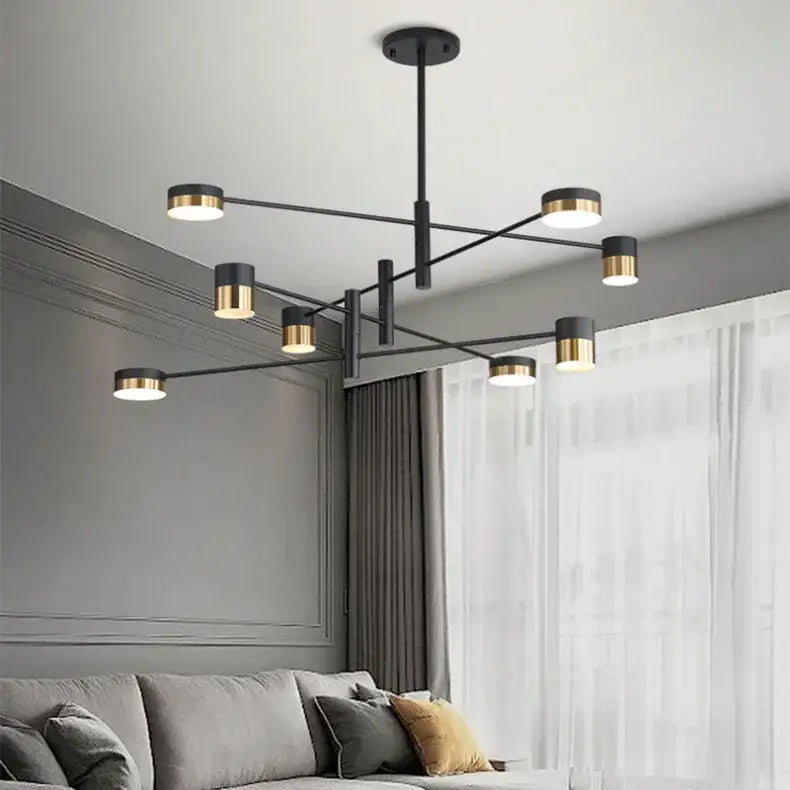 Modern nordic black gold pendant light with sleek geometric arms and cylindrical fixtures ideal for living room decor
