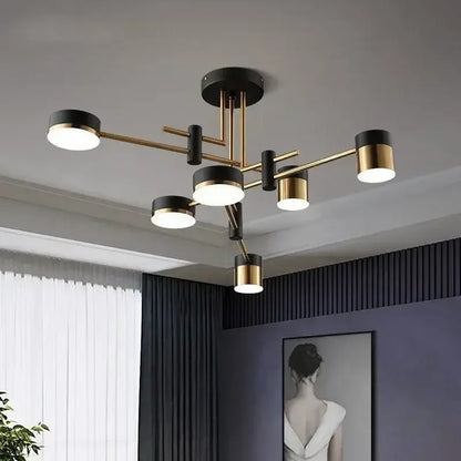 DecorBites™ Nordic black gold pendant light with sleek black and brass cylindrical shades for modern living room decor
