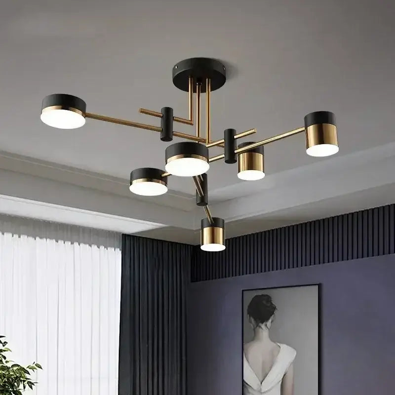 DecorBites™ Nordic black gold pendant light with sleek black and brass cylindrical shades for modern living room decor