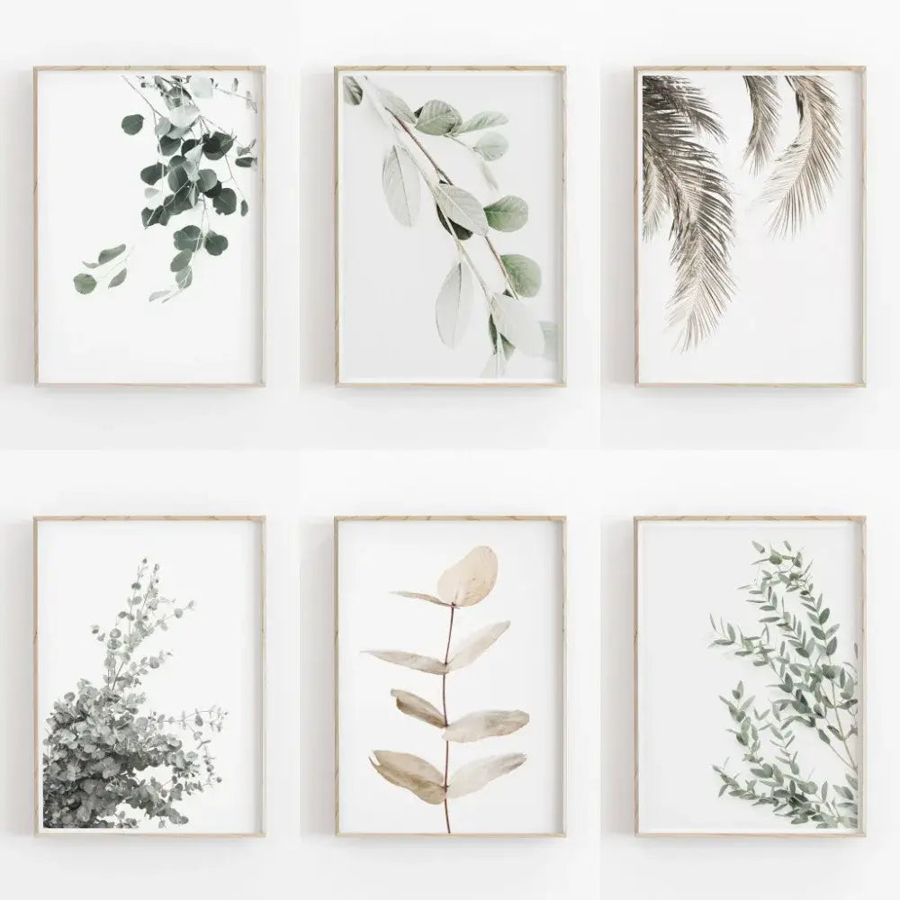 Set of six framed nordic botanical posters featuring eucalyptus and palm leaves in soft greys green and beige on canvas
