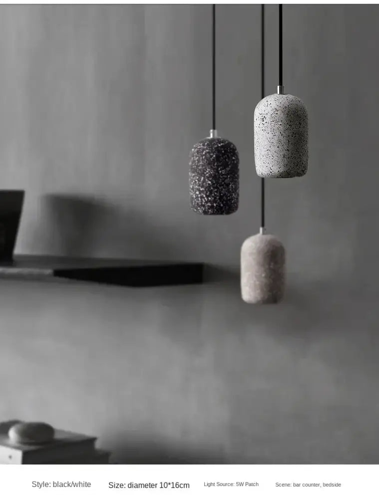 Three decorbites™ nordic cement pendant lamps with speckled concrete finish in gray and white for industrial style lighting
