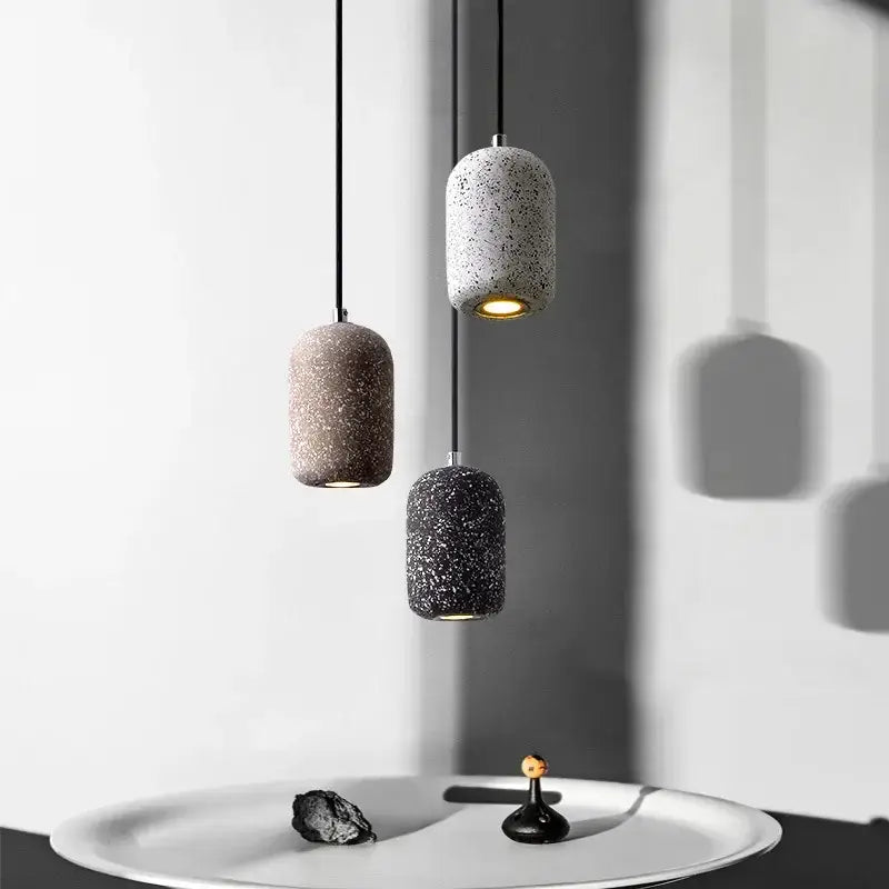 Three decorbites™ nordic cement pendant lamps in gray brown and black with speckled concrete finish for industrial style lighting