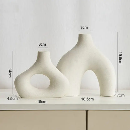 Cream-colored nordic ceramic vases home decor with organic sculptural forms and a matte finish by decorbites™