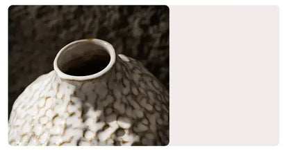 DecorBites™ nordic ceramic vase with a textured pebbled surface and subtle gold accents holding pampas grass