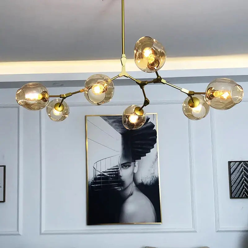 Gold-toned DecorBites™ nordic chandelier with amber glass globes and branching metal frame for living room hanging light fixture