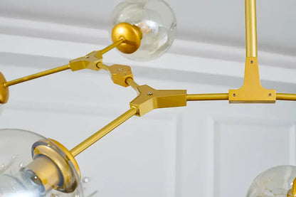 Gold-toned metal nordic chandelier with clear glass globe bulbs hanging light fixture for living room and dining room
