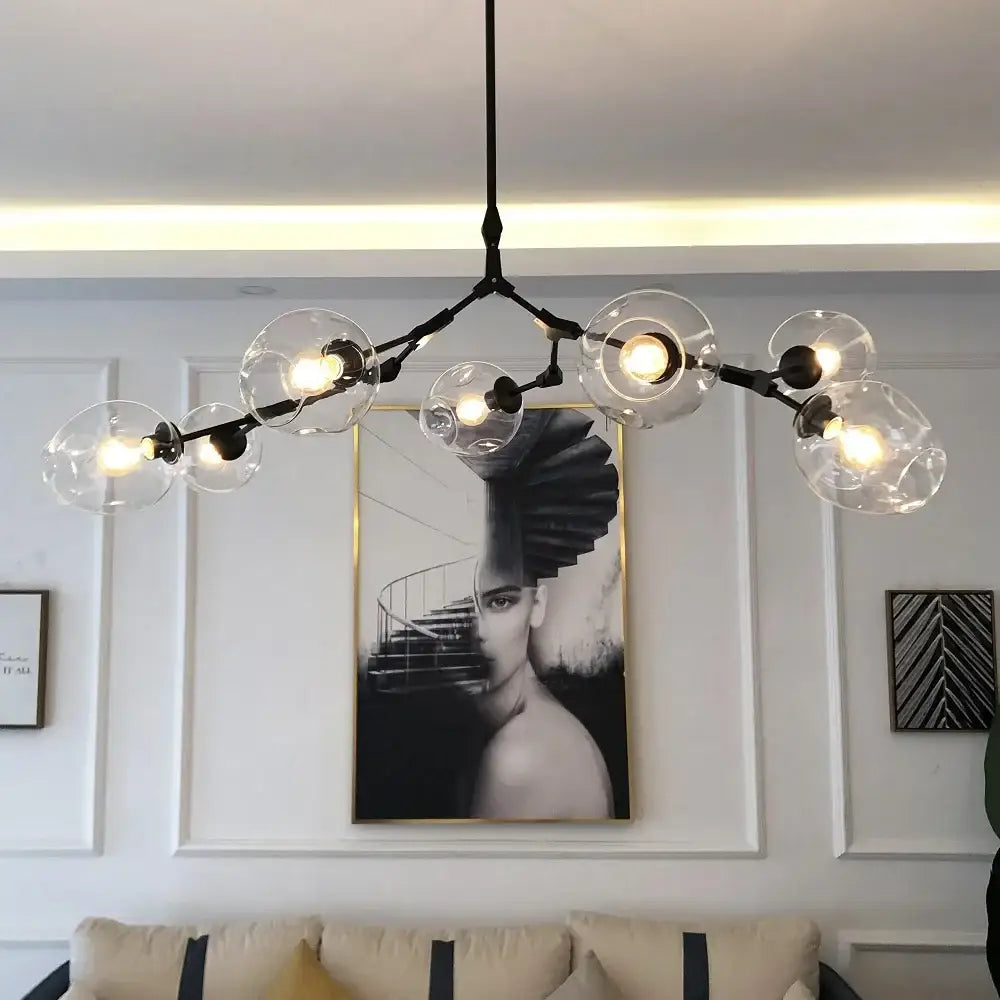 Modern black metal nordic chandelier with clear glass globe bulbs for dining and living rooms by DecorBites™