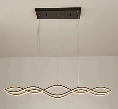 Modern black rectangular ceiling mount with three gold-toned LED light strands in a wave pattern for dining room decor pendant lights