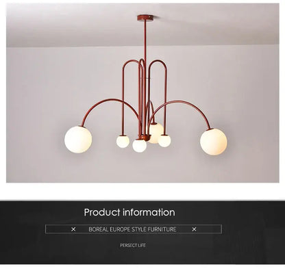 Modern copper-toned DecorBites™ nordic comet chandelier with curved metal arms and frosted glass globe shades