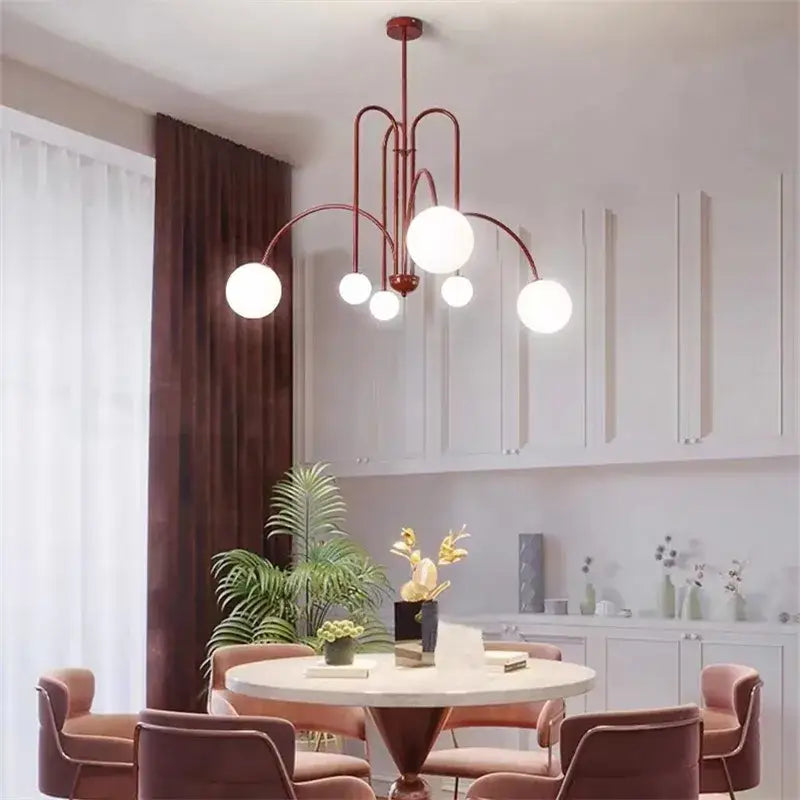 A modern DecorBites™ comet chandelier nordic with matte red metal frame and white glass ball shades for elegant décor