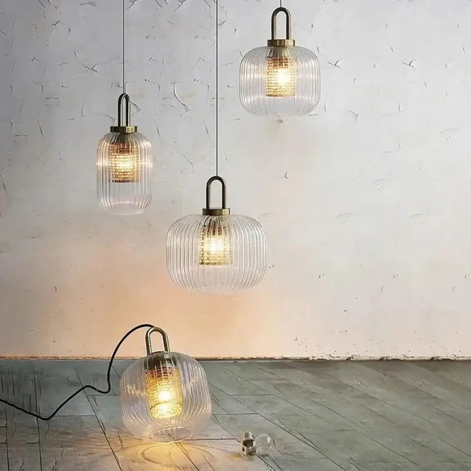 Clear ribbed glass pendant lights with brass accents complement DecorBites™ nordic deer head wall lamp vintage resin decor