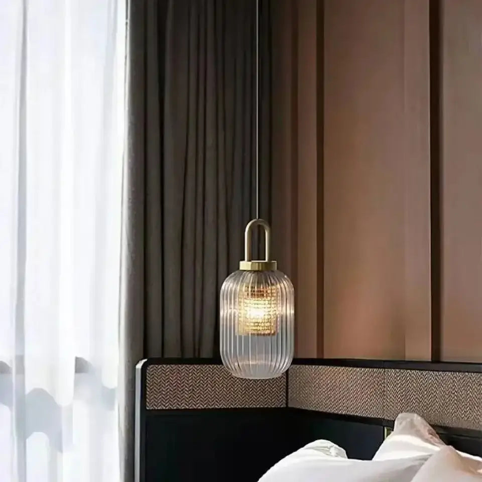 A decorbites nordic deer head wall lamp with vintage resin decor featuring a modern clear ribbed glass pendant light and brass fixture