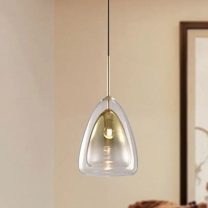 Decorbites nordic pendant light fixture with clear teardrop glass shade and gold-toned metal suspension in champagne