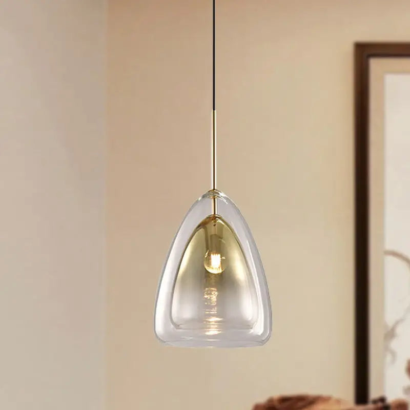 Decorbites nordic pendant light fixture with clear teardrop glass shade and gold-toned metal suspension in champagne