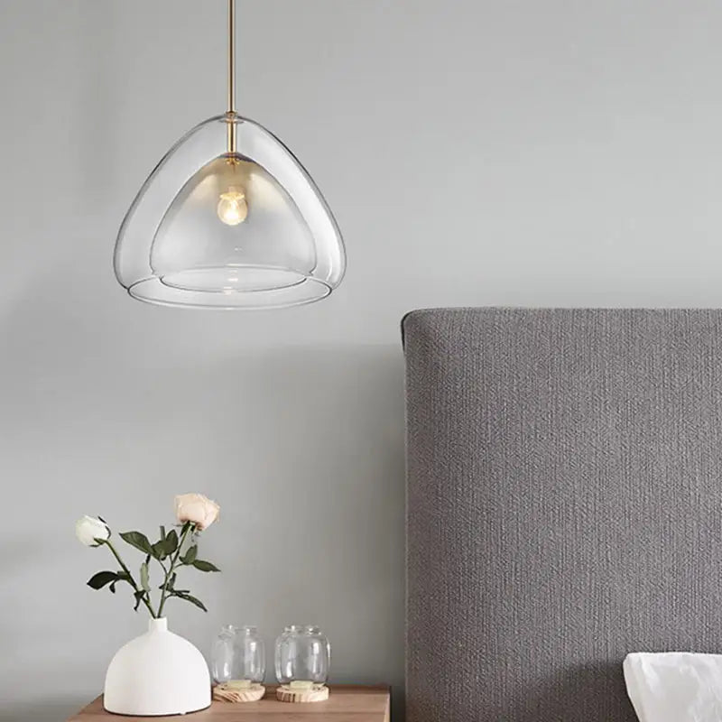 DecorBites™ nordic double glass cone pendant light fixture with gold-tone metal and illuminated bulb in champagne suspension