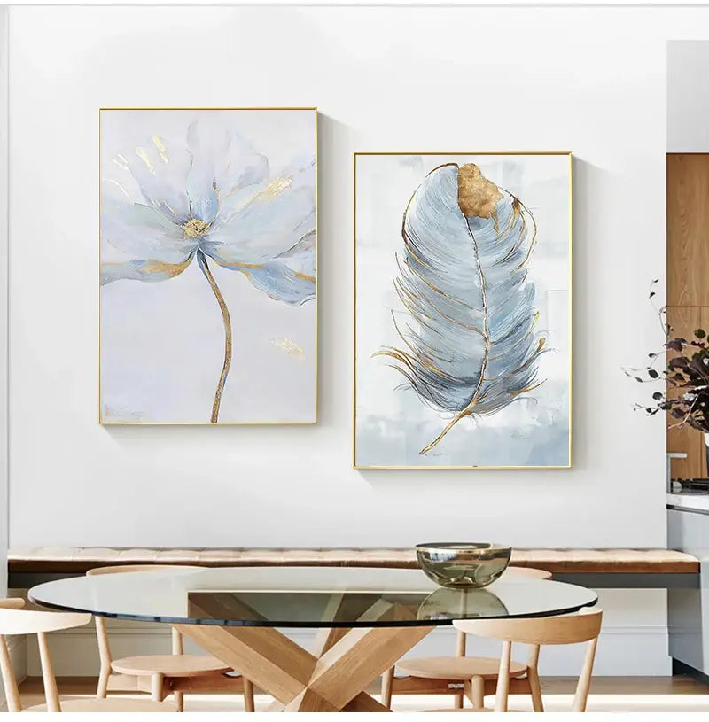 Two framed canvas art pieces featuring nordic flower abstract blue flower and feather design with gold accents