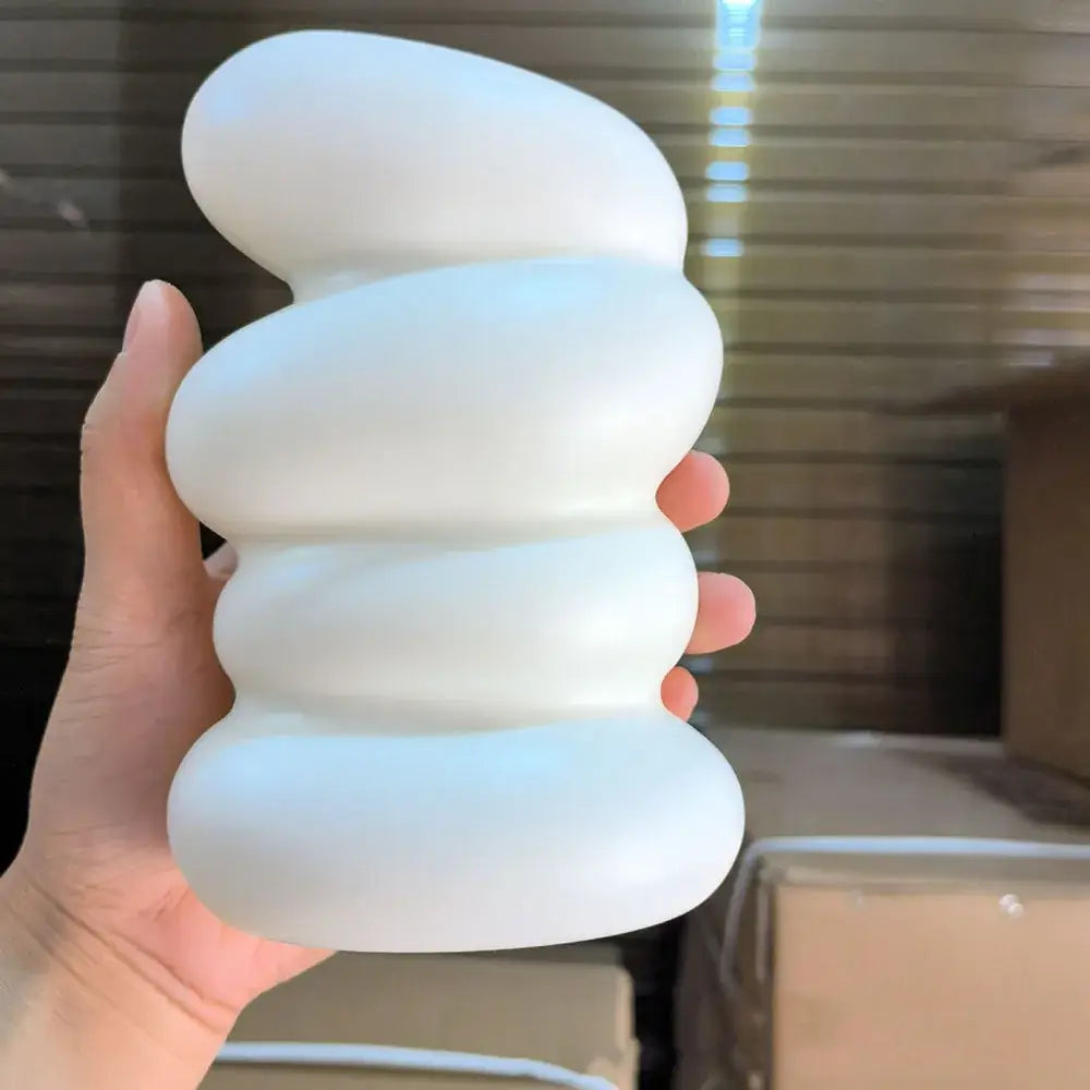 A smooth matte white ceramic nordic flower vase with a modern stacked oval design for modern home decor