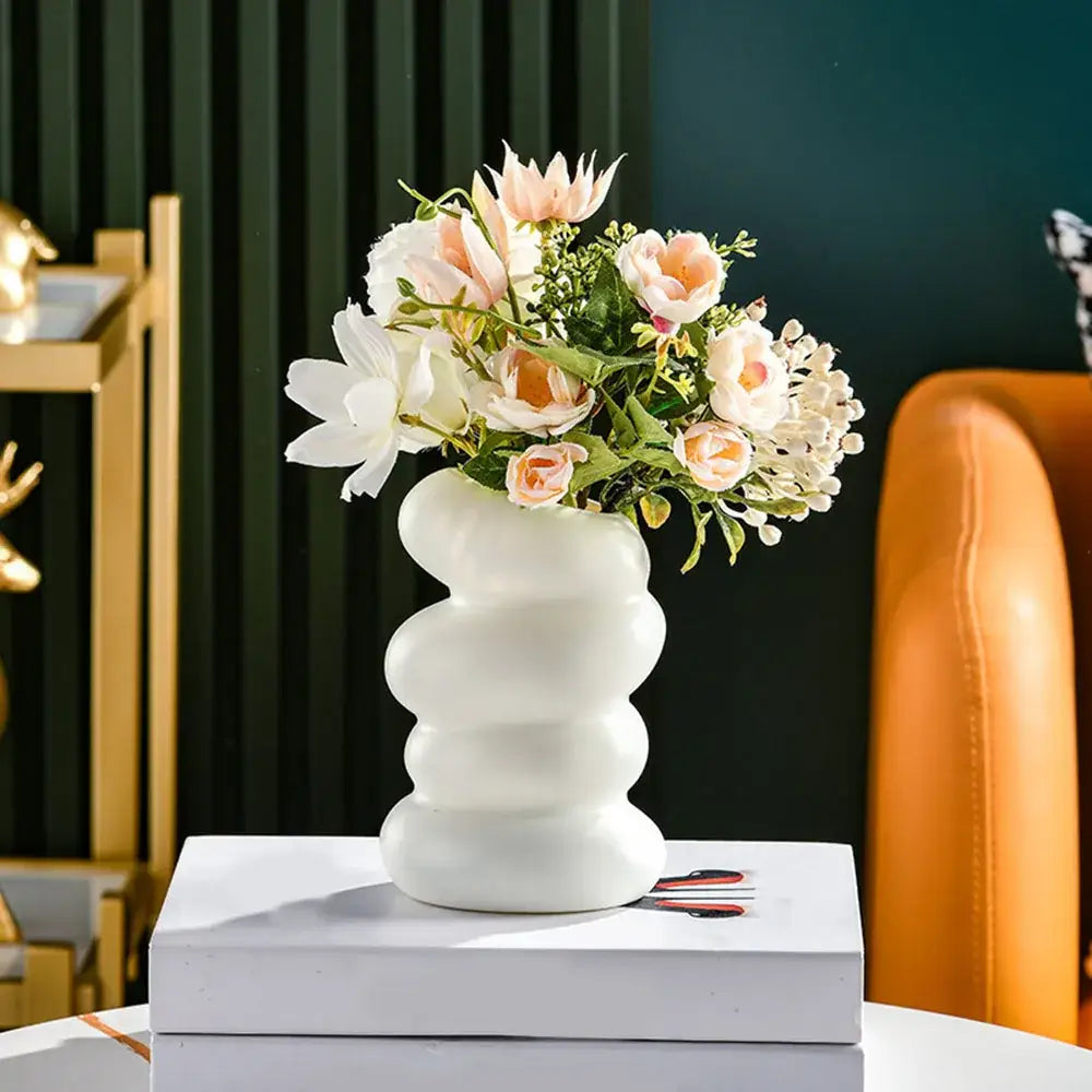 White ceramic nordic flower vase with wavy segmented design for modern home decor by DecorBites