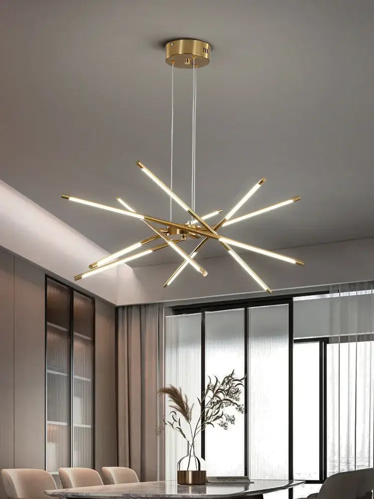 Modern gold-toned led chandelier with sleek intersecting rods featuring nordic geometry and remote control by DecorBites