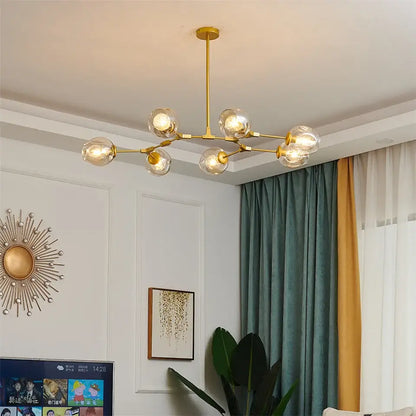 Gold-toned nordic glass ball led chandelier with six clear glass globe bulbs in black and gold finish
