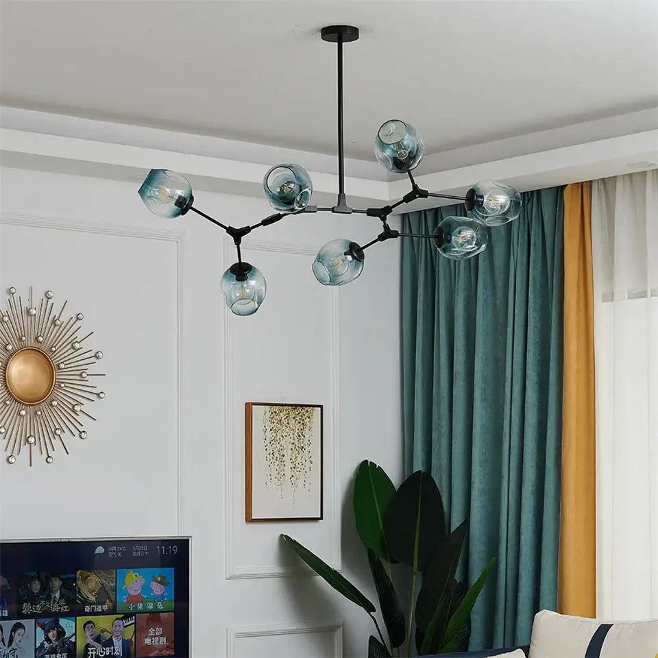 Modern black metal ball led chandelier with translucent teal nordic glass ball bulbs from DecorBites™ black gold series
