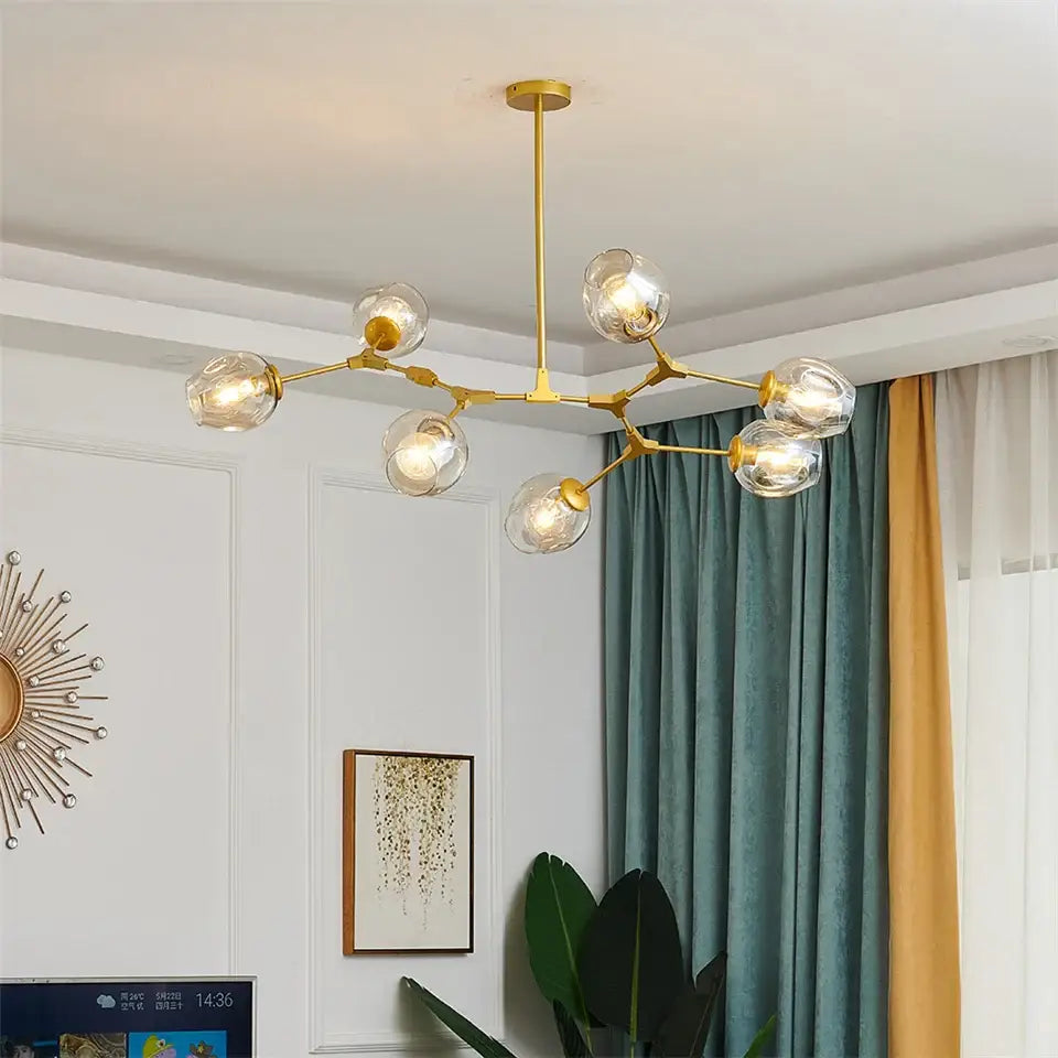 Gold-toned decorbites™ nordic glass ball led chandelier with clear globe bulbs and branching metal frame in black gold
