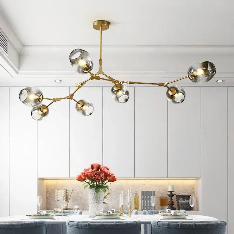 DecorBites nordic glass ball LED chandelier in black gold with gold-toned frame and clear glass globe shades